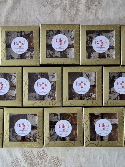 A bulk order of Moong Daal Barfi packed in beautiful golden window boxes, each with my brand sticker. Perfect for corporate or festive gifting.