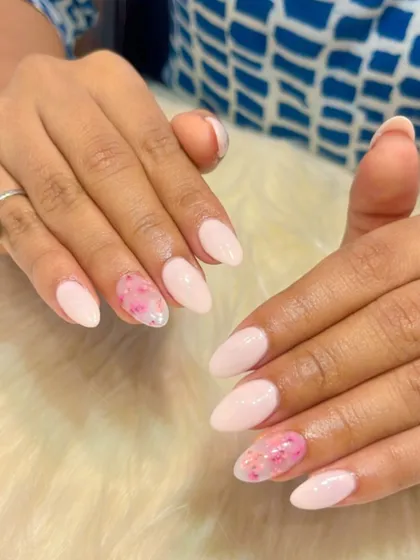 Another look at this pretty pink floral design. The watercolor-style flowers on the accent nails add a soft, artistic touch to the manicure.