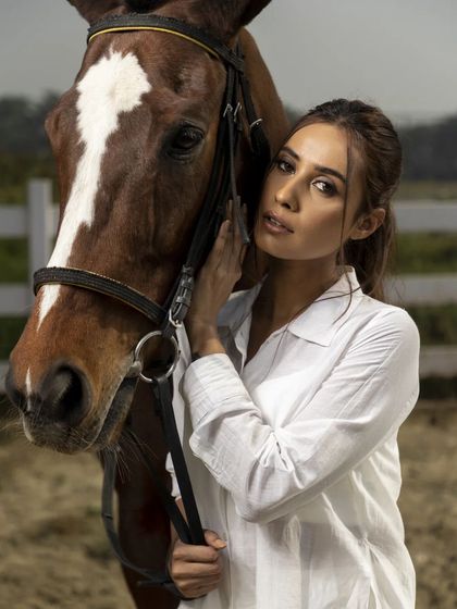 Another portrait from the equestrian series, this time with a different model in a classic white shirt. It showcases my ability to create a cohesive look across different models and outfits.
