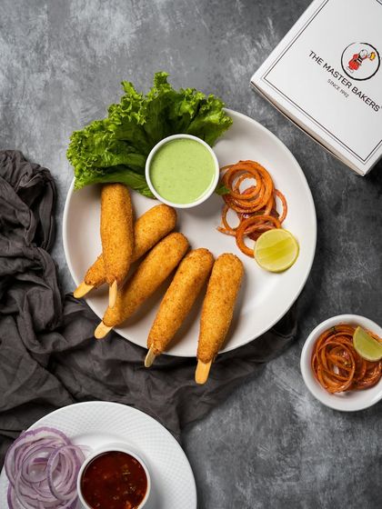 Our Dahi ke Kebabs are soft, tangy, and incredibly flavorful. Made from hung curd and delicate spices, they are fried to a perfect golden brown and served on sticks for easy enjoyment.