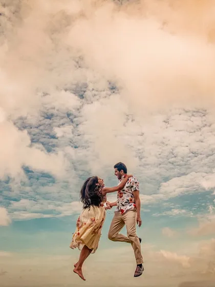 Sapni and Arjun seem to fly amidst the clouds of Bali. This creative and joyful portrait captures a feeling of weightlessness and pure happiness.