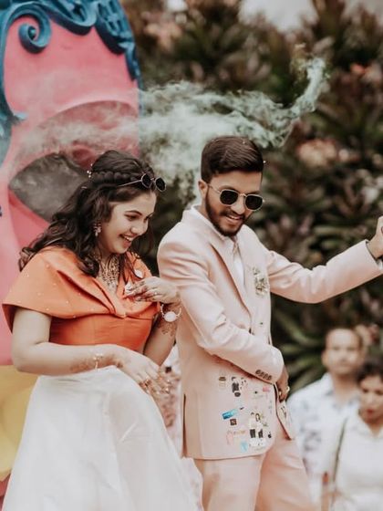 The couple dancing with smoke effects in the background, creating a fun and energetic vibe.