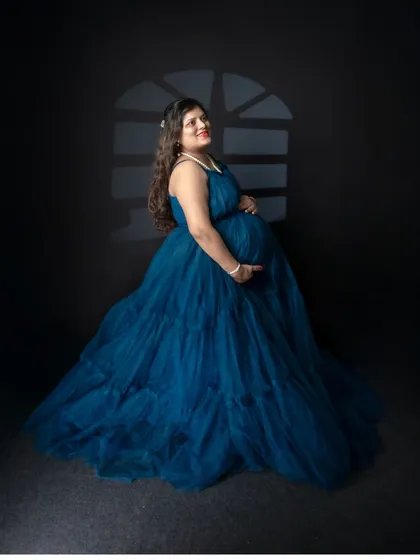 I use different lighting techniques to create mood. Here, a "gobo" or light modifier creates the effect of a window silhouette, adding depth and a sense of intimacy to the portrait.
