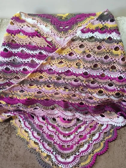 This is the famous 'Virus Shawl', and it's one of the most rewarding projects to complete. The intricate, lacy pattern looks complex, but I guide my students through each step to create their own gorgeous, flowing shawl using self-striping yarn.