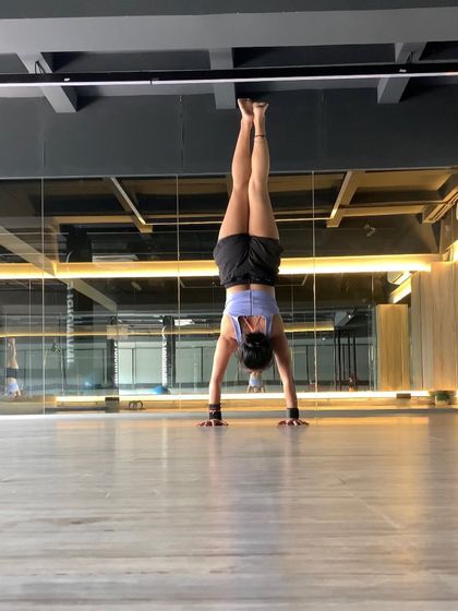 Hello Sunday. A handstand in a spacious studio, enjoying the feeling of being upside down and the quiet focus it brings.