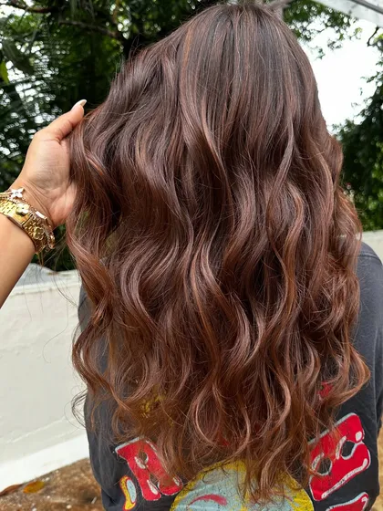 Getting her ready for a work trip with a professional yet stylish look. These 'Almond Brown' tresses are chic and sophisticated, with just enough color to feel fresh and confident.