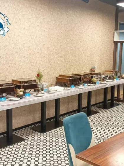 The full buffet line ready for the Diwali lunch at Blis Global, showcasing the variety of dishes offered.