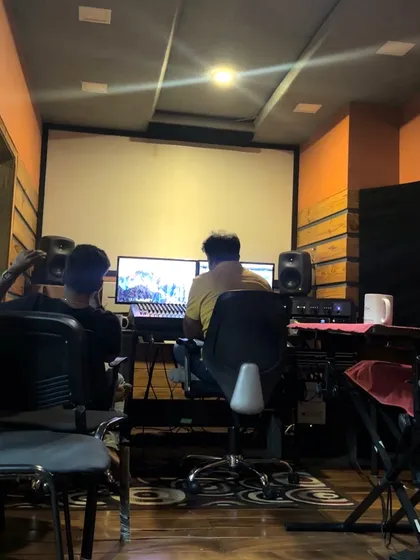 The view from the other side of the glass. This is where the sound engineer and composer work their magic, listening to every detail to ensure we get the perfect take.