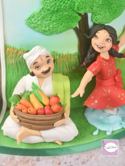 A happy farmer with a basket full of produce, another key element from the 'Dharma' side of the Dharmasthapane cake. The contrast between this and the weeping farmer on the other side is what makes the story so powerful.