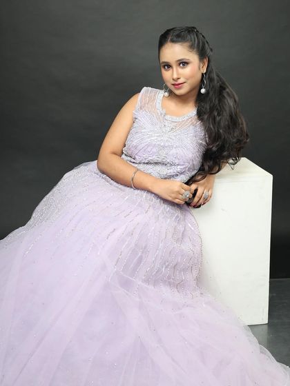 The full A-line silhouette of the lavender gown. It is flattering for many body types and comfortable to wear.