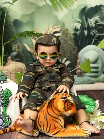 A cool little soldier with sunglasses. I love adding fun and playful elements to our themed shoots to bring out your child's personality.