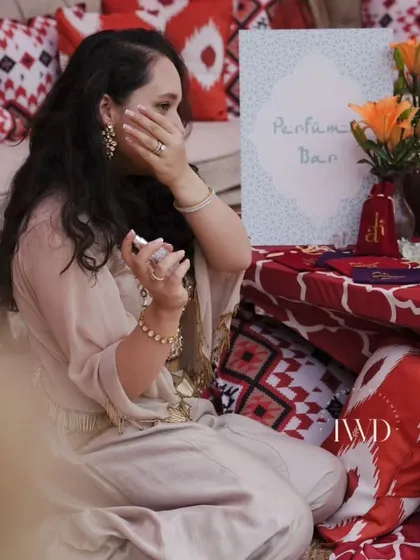Our co-founder testing a freshly blended scent at our interactive Perfume Bar. This unique station allowed guests to mix their own fragrances, creating a personalized and memorable wedding favor.