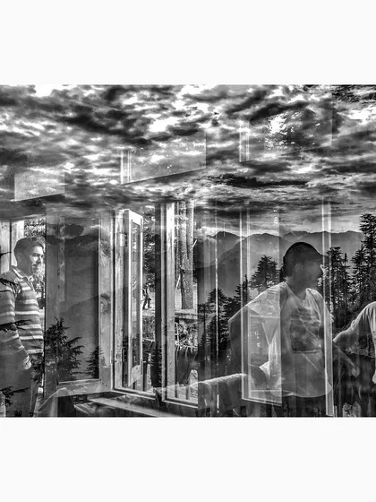 A dramatic black and white reflection from Jibhi, Himachal Pradesh, where mountains, clouds, and people converge. This image transforms a simple conversation into a powerful landscape of human experience.
