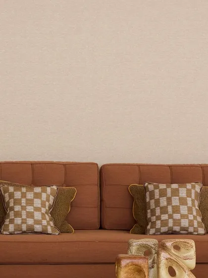 The 'Saint-Honoré' sofa by Nobilis is upholstered in 'Cima', an indoor/outdoor satin that mirrors the elegance of combed wool. Paired with checkered cushions, it is a statement in discreet luxury and effortless refinement.