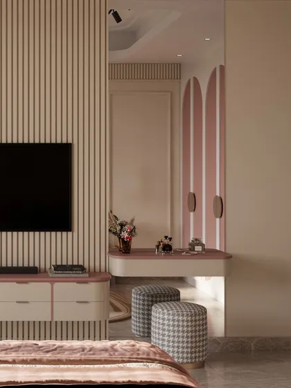 A dedicated vanity nook is seamlessly integrated next to the media wall. A full-length mirror reflects the room's soft palette and arched details, creating a functional and glamorous space for a young girl.