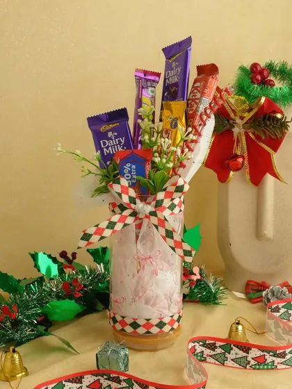 A festive chocolate bouquet in a jar, perfect for a Secret Santa gift. It's a sweet and simple way to spread some holiday cheer.