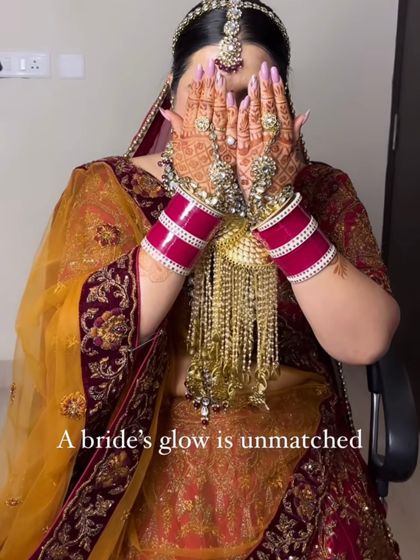 "A bride's glow is unmatched." A candid shot capturing the beauty of the bride and her intricate mehndi.