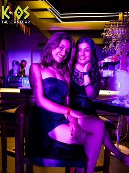 Two friends dressed up and ready to party, capturing the stylish and fun atmosphere of our events.