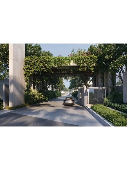 The entrance to the 'Poetry of Earth' development is designed to feel like entering a private park. A green bridge creates a lush canopy over the driveway, immediately immersing residents and visitors in the project's nature-centric theme.