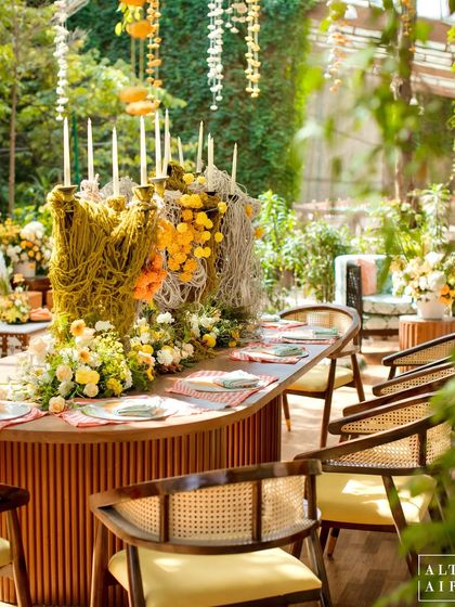 A close-up of the unique centerpiece at the 'Kesar Sehar' Haldi, combining traditional marigolds with modern thread art. The design was all about giving a new approach to Indian heritage.