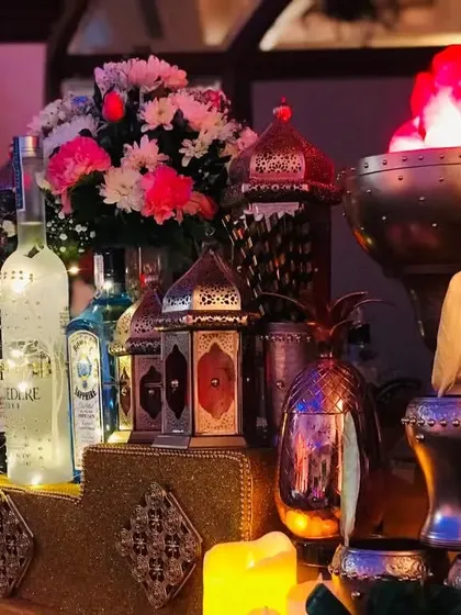 For an evening of royal grandeur, my Sufi-themed bar sets a luxurious and mystical tone. The warm glow from ornate Moroccan lamps, brass elements, and elegant floral decor creates an unforgettable, opulent experience for your reception.