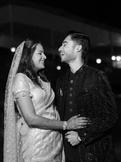 The laughter and love between Sanket and Sakshi are palpable in this candid black and white portrait. After eight years, their connection is a beautiful story to tell.