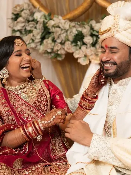 A spontaneous moment of laughter between the bride and groom. We believe these candid interactions are the heart of wedding photography, telling a story of genuine connection and happiness.