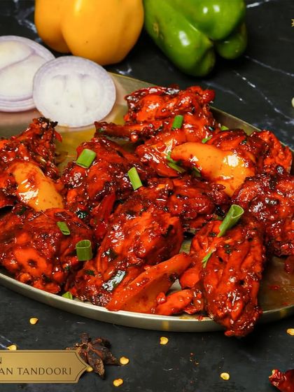 Our Chicken Schezwan Tandoori is a flavor explosion. Tandoori-grilled chicken is tossed in a fiery Schezwan sauce for a perfect fusion of smoke and spice.