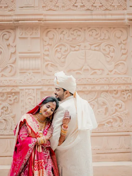 A tender and loving pose. The bride rests her head on the groom's shoulder, a beautiful gesture of comfort and affection.