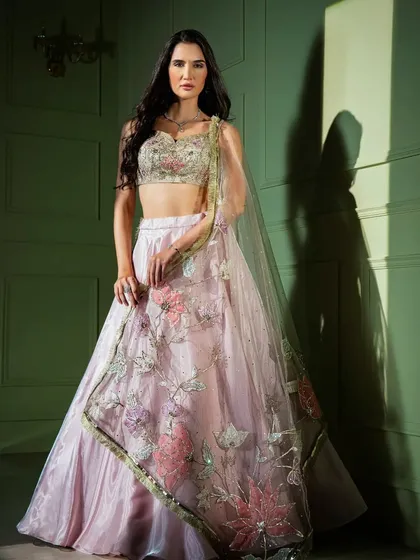 Soft, romantic, and exquisitely detailed. This pastel pink organza lehenga features delicate 3D floral and butterfly embroidery, perfect for a day wedding or engagement.