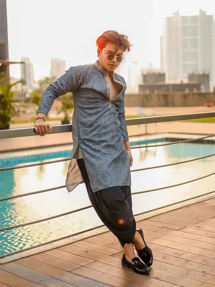 A modern ethnic look for men, shot by a poolside at sunset. This shows how I can style traditional wear in a contemporary and fashionable way for men's portfolios.