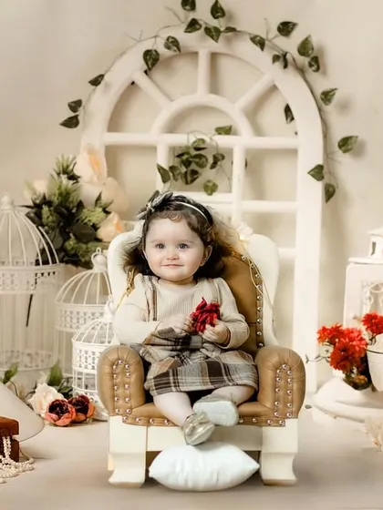 A wider view of our beautiful and intricate vintage-inspired studio setup, perfect for classic portraits.