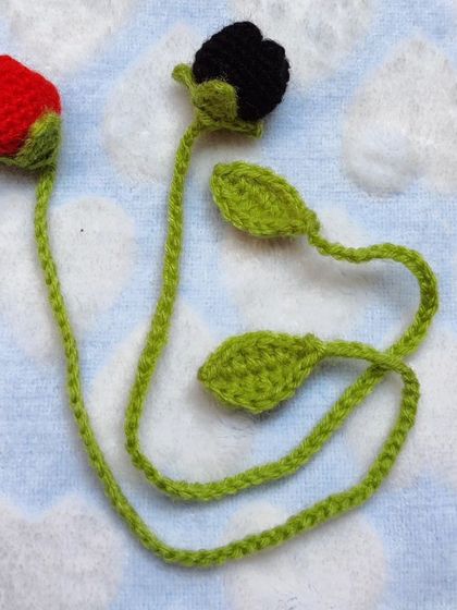 Red and black tulip bookmarks shown together.