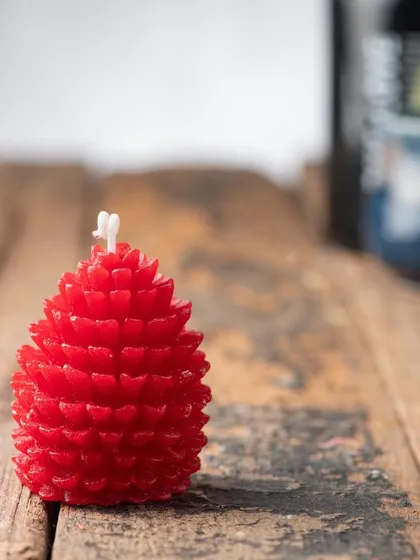 A bright red pinecone candle, full of festive cheer. These look wonderful grouped together on a mantlepiece.