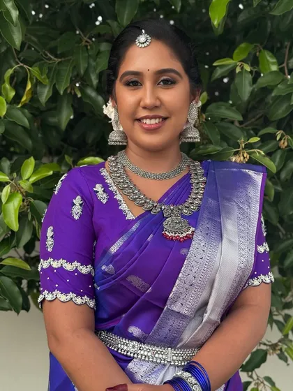 A full-length view of Dr. Indhu's "Silver Bride" look. The oxidized silver jewellery, including the necklace, earrings, and oddiyanam (waist belt), creates a unique and modern ethnic statement.