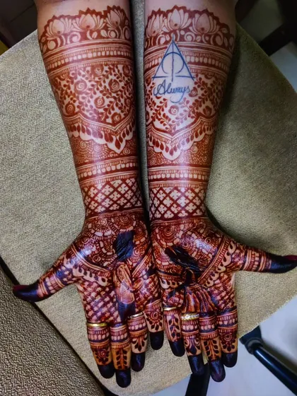 The stain is everything. Here you can see the amazing, deep color of my 100% natural henna paste after 48 hours. This client was a huge Harry Potter fan, so we included the Deathly Hallows symbol with "Always" for a personal touch.
