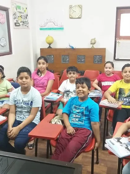 A snapshot of one of our kids' batches in our Rohini classroom. We intentionally keep our class sizes small to ensure every child receives individual attention from our experienced faculty, creating a comfortable and effective learning environment for all.