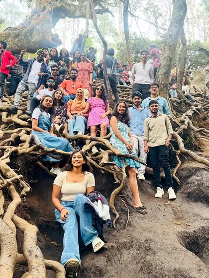 Another shot of our group at the famous tree with massive exposed roots, a testament to the unique nature here.