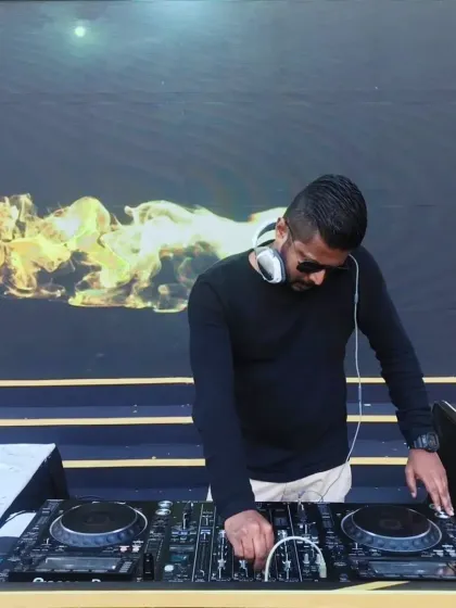 In my element at a daytime wedding event. A clear shot of my professional Pioneer DJ console against a vibrant backdrop shows my commitment to quality sound and a seamless musical experience, no matter the time of day.
