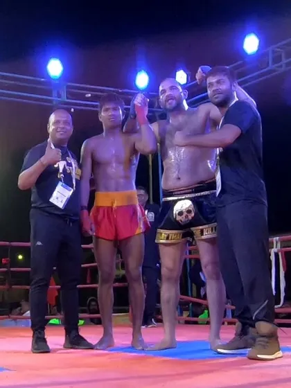Celebrating with the team and the opponent after the fight. Respect is the foundation of martial arts.