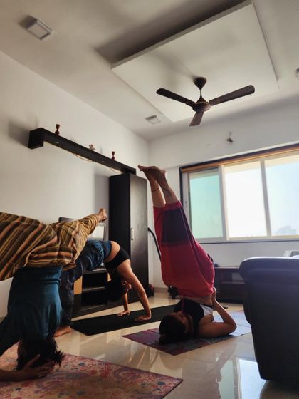 A fun, topsy-turvy moment with friends. We're all at different stages of our inversion practice, but we're supporting and learning from each other.