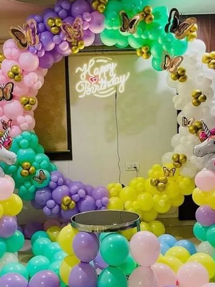 Another look at a vibrant unicorn and butterfly themed balloon ring. This shows how I can fill a space with colorful balloons on the floor to create a more immersive party atmosphere.