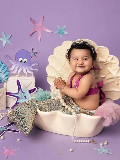 Diving into a world of imagination with this adorable mermaid session. My studio is filled with enchanting props like this seashell to bring your little one's fairytale dreams to life.