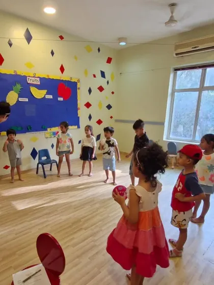 A wide shot of a classroom activity. Our sessions are structured to include a variety of exercises that cater to different learning styles and build a range of skills.