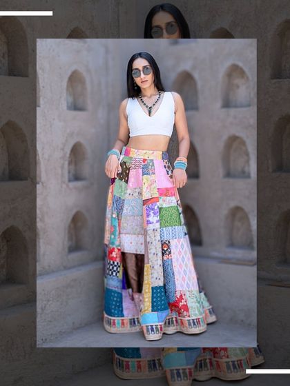 Another stylish pose in the patchwork lehenga, showing how it can be styled for a fashion-forward look.