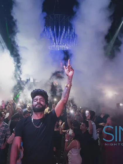 A powerful shot of me at SinQ, Goa, with smoke rising behind me like wings.