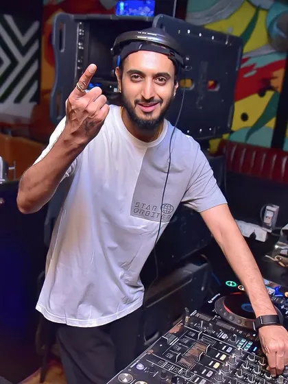 Pointing to the camera, fully in my element. The only love affair I've ever had was with music.