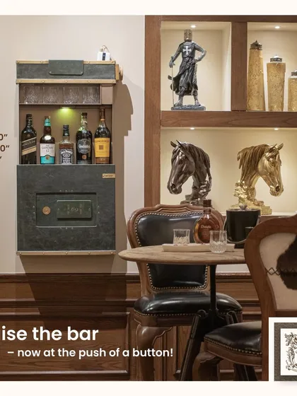 The PO Box 69, our wall-mounted automated bar, shown here in its open position. This space-saving design provides a complete bar setup with shelving for bottles and glasses, all concealed within a stylish, leather-clad unit.