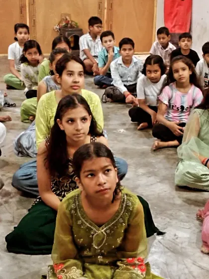 The girls and boys of my academy, sitting together. We welcome everyone who is willing to work hard.