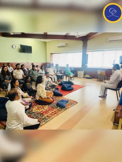 A group of devotees listening intently during a Sunday Satsang. These sessions provide practical spiritual tools and inspiration that we can carry with us into our daily lives, helping us to live with greater awareness and joy.